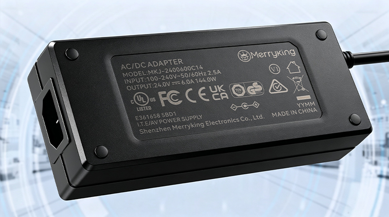 Safety certification logos engraved on the back of an industrial power adapter casing